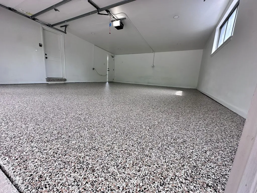 Homeowner maintaining epoxy-coated garage floor